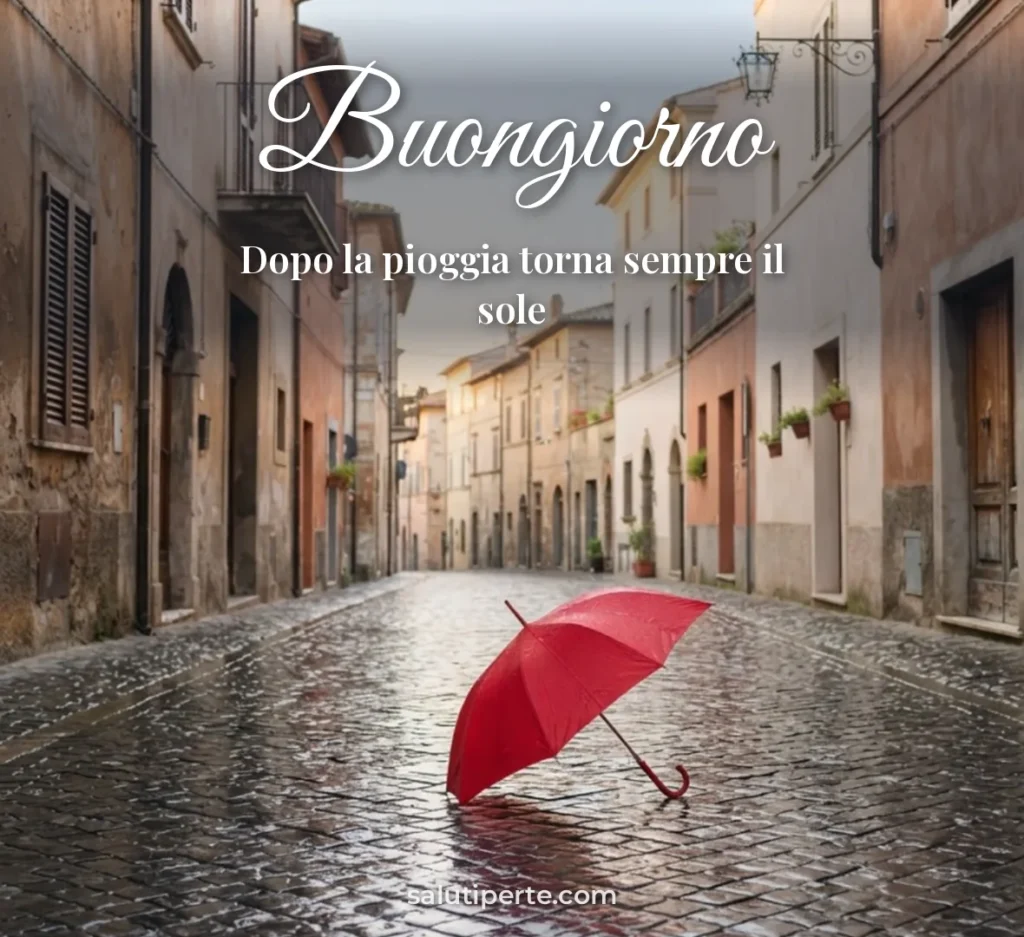 Ombrello rosso sotto la pioggia in città